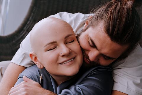 A couple sharing a warm embrace, reflecting love and support in a cozy setting.